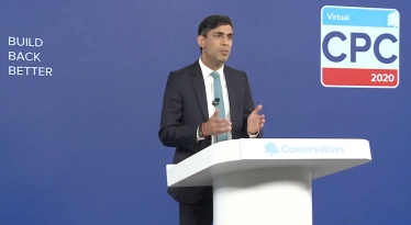 Chancellor of the Exchequer Rishi Sunak at a podium